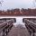 Lake of the Woods floating dock at spring ice-out with calm water and cottage